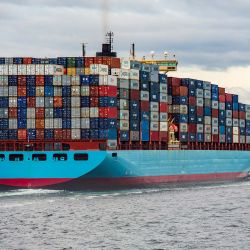 A loaded cargo ship at sea